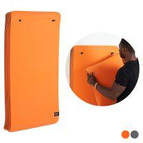 Man Hanging Mat on Mirafit Yoga Mat Hanger