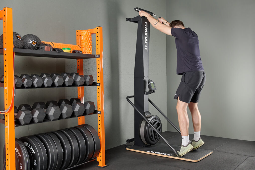 man using a Mirafit Ski Machine in the gym