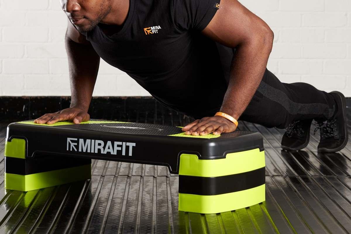 Man doing a push up on a Mirafit Aerobic Exercise Step