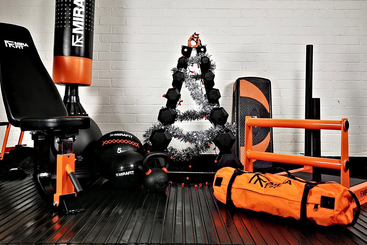 collection of mirafit garage gym equipment in a garage ready to be wrapped as a christmas present