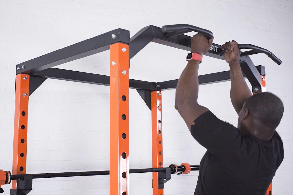 Man performing a Chin Up on the Mirafit power rack