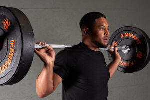 Barbell back squat with Mirafit Crumb Rubber Olympic Bumper Plates
