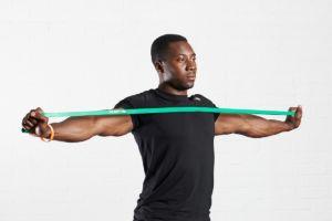 Man stretching with a Mirafit Resistance Band