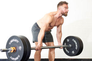 Man deadlifting with a Mirafit Olympic Barbell and Bumper Plates