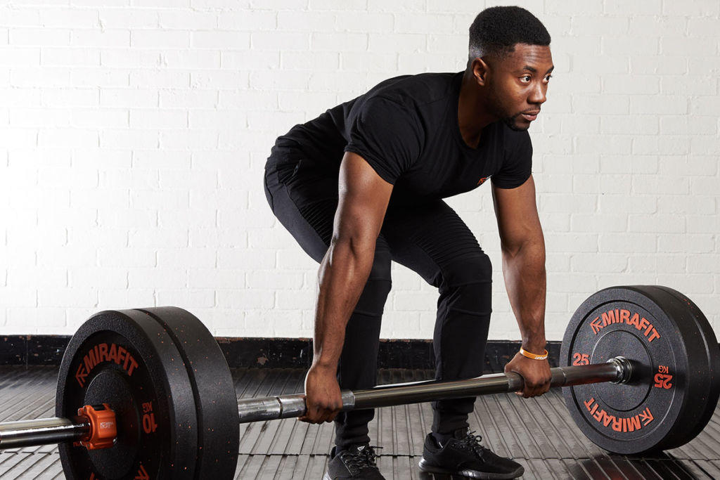 Mirafit 7ft Thick Grip Olympic Bar Man deadlifting with a thick grip barbell