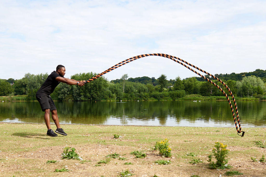 Man does Power Slams with Mirafit 38mm Black & Orange Battle Ropes