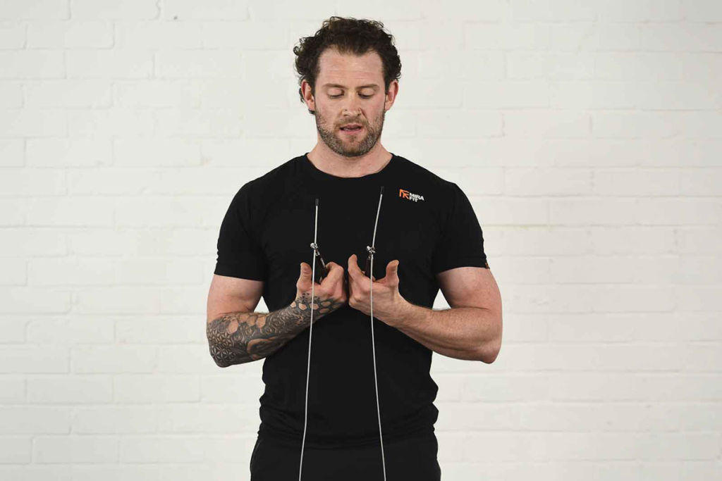 Mirafit 3m Adjustable Ball Bearing Speed Rope Man holding a Mirafit 3m Adjustable Ball Bearing Speed Rope