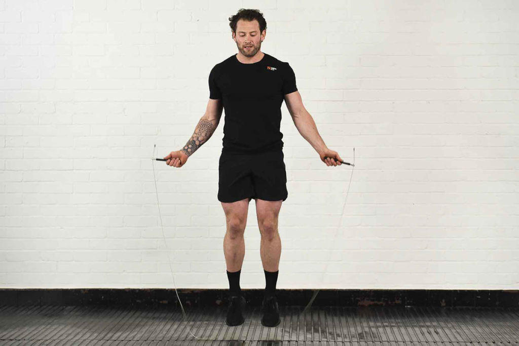 Mirafit 3m Adjustable Ball Bearing Speed Rope Man exercising with a Mirafit 3m Adjustable Ball Bearing Speed Rope