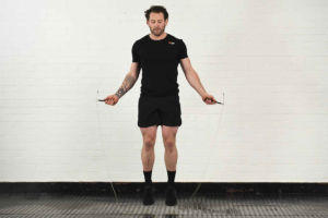 Man exercising with a Mirafit 3m Adjustable Ball Bearing Speed Rope