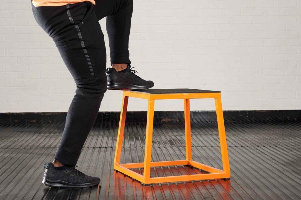 Toe taps Man doing toe taps on a Mirafit Steel Plyo Jump Box