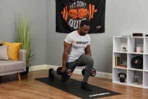 Man doing a lunge with Mirafit 10kg Dumbbells