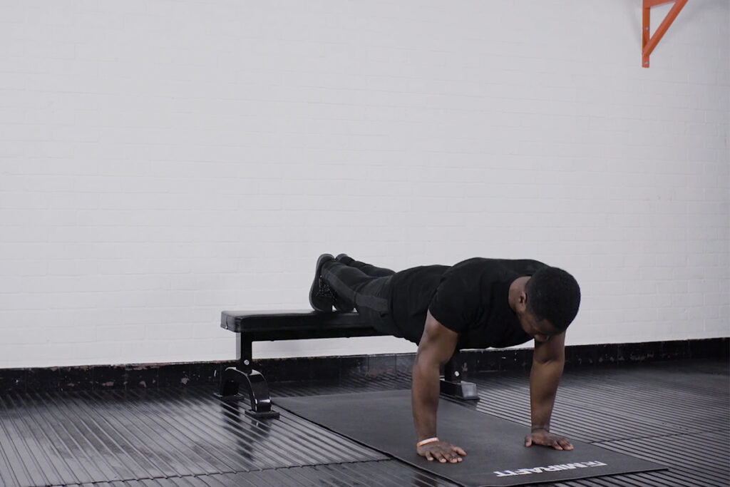 Descending Press Up Man performing a descending press up