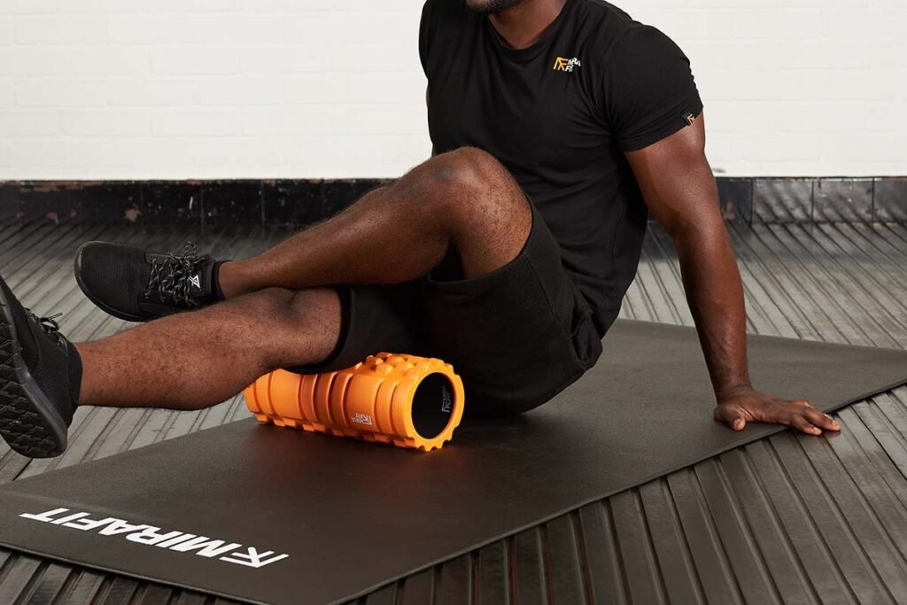 Man using a Mirafit Deluxe Hi-Density Foam Roller