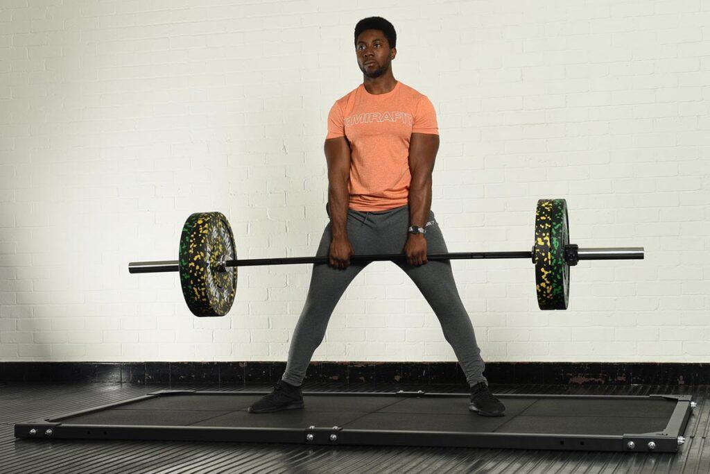 Mirafit Deadlift Platform Man performing a deadlift on a Mirafit deadlift platform