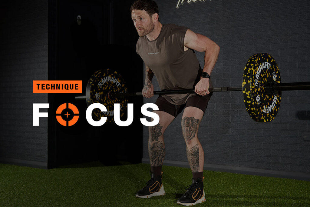 Man doing a barbell row with 15kg weight plates