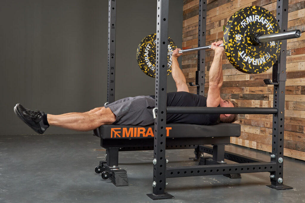 Mirafit M3 Flat Weight Bench Man doing a Larsen Press in Mirafit M3 Power Cage