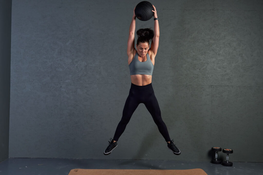 Mirafit Fitness Specialist Performing Medicine Ball Slam