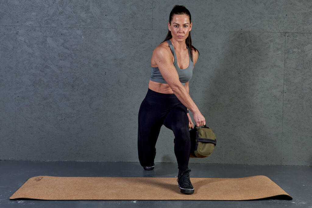 Sandbag lunge Woman performing a sandbag lunge with a Mirafit Multi Grip Workout Sandbag