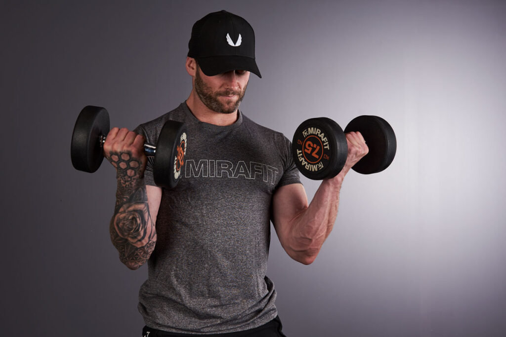 Mirafit Fitness Specialist Performing Bicep Curls with Mirafit 7.5kg Dumbbells
