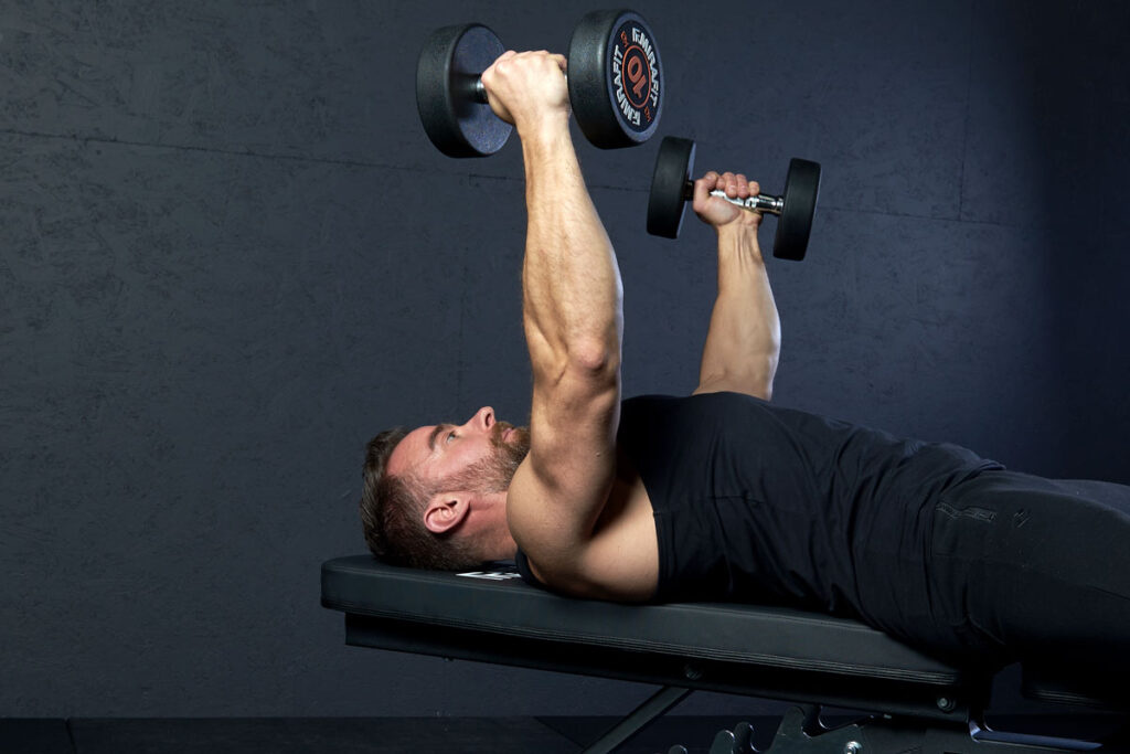 Man Performing Dumbbell Chest Flys Mid Extension with Mirafit 10kg Dumbbells