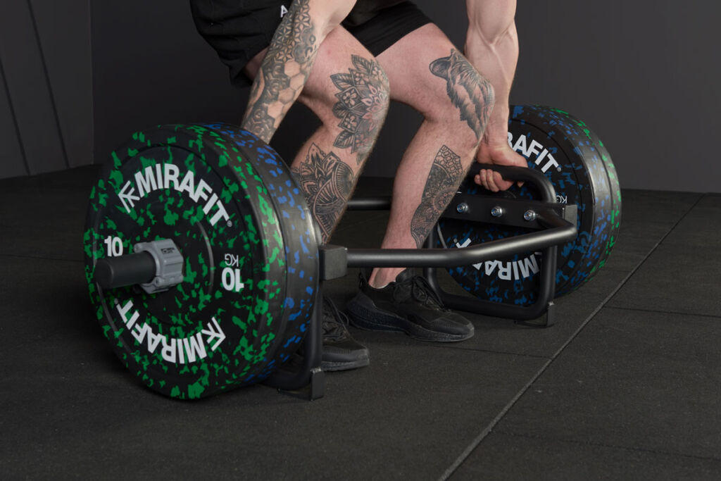 Man Deadlifting with a Mirafit Trap Bar and 10kg weight plates