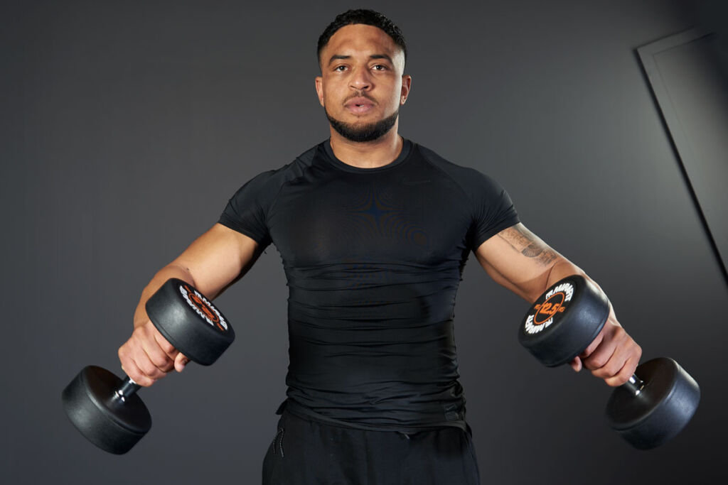 Mirafit Rubber Dumbbell Set - 12.5kg Dumbbells Man performing dumbbell Lat Raises at Mid Extension with Mirafit Rubber 12.5kg dumbbells