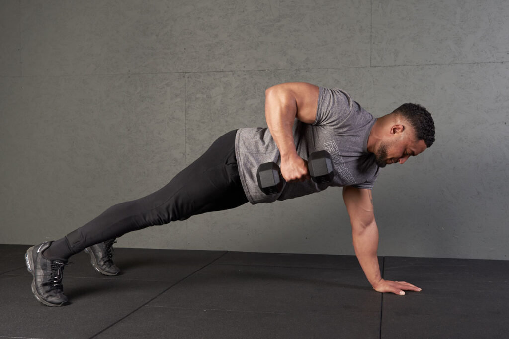 Man performing a renegade row using Mirafit hex dumbbells