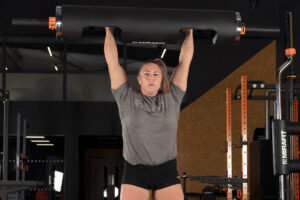 Strongwoman Donna Moore pressing a Mirafit 10" Strongman Log