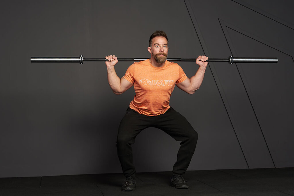 Man doing a 1.5 rep squat