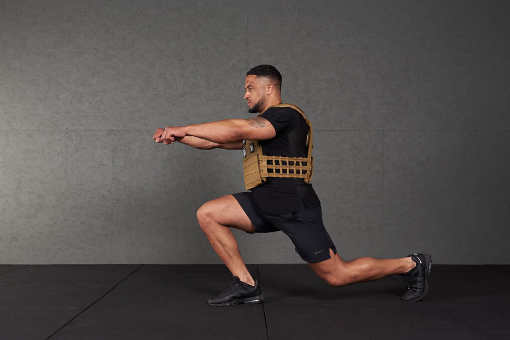Forward Lunge Man doing a forward lunge with a Mirafit Tactical Weight Vest