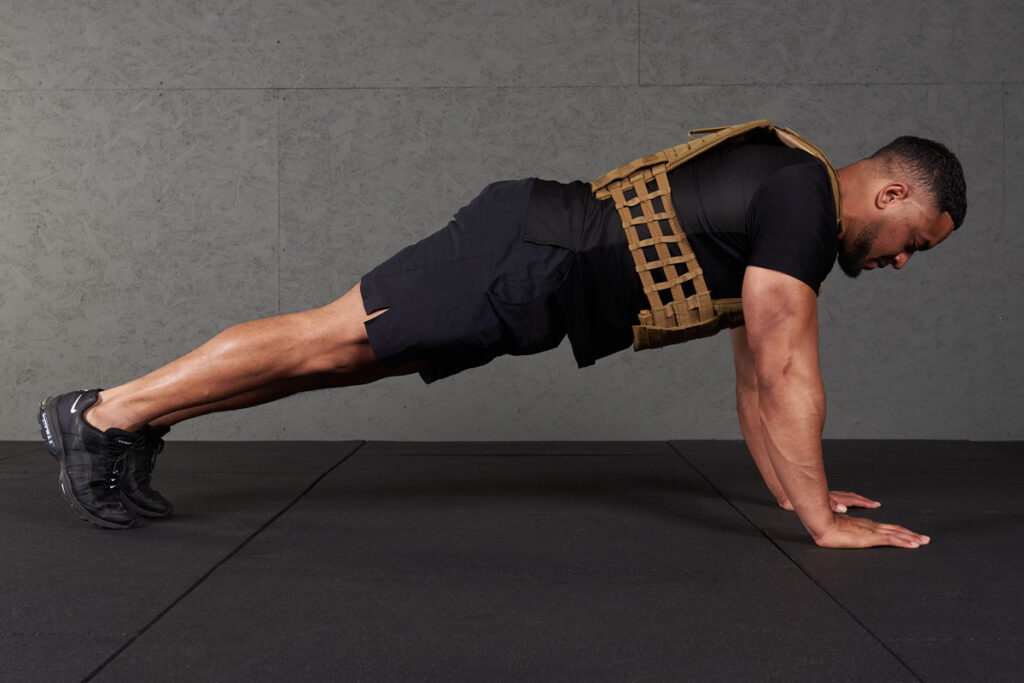High Plank Man doing a high plank with a Mirafit Tactical Weight Vest