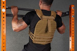 Man doing a pull up with a Mirafit Tactical Weight Vest