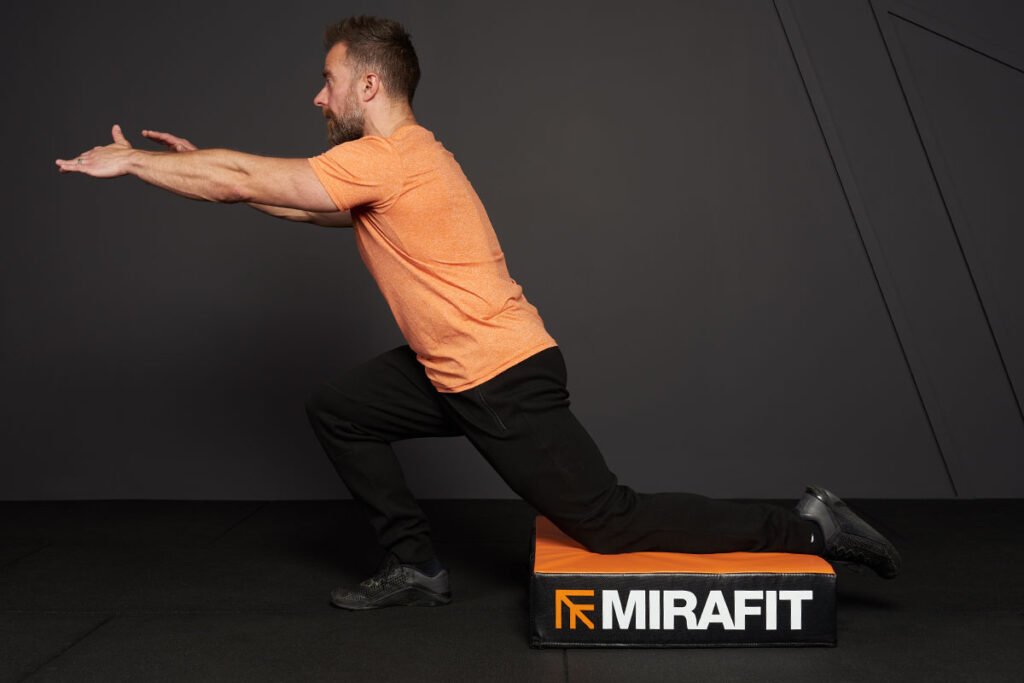 Man doing a skater squat on a Mirafit Barbell Squat Pad