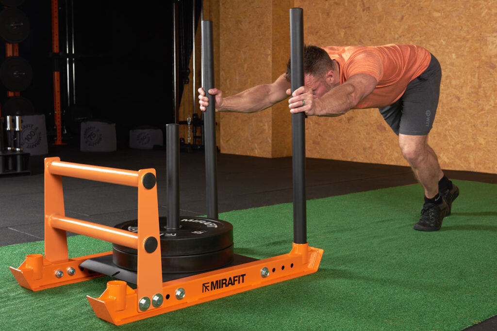 Sled Push Man doing a sled push with a Mirafit Weight Sled