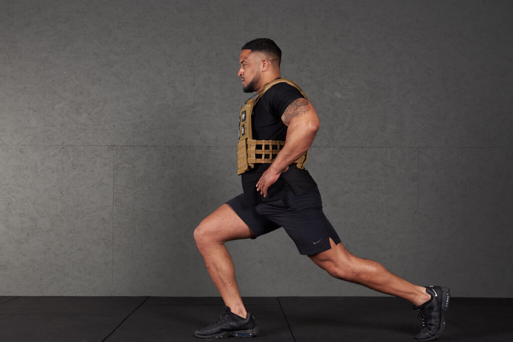 Split squat Man doing a split squat with a Mirafit Tactical Weight Vest