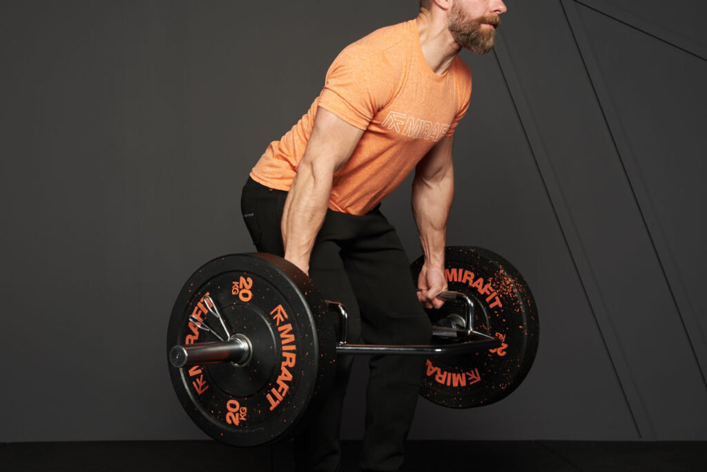 Man doing a trap bar squat with a Mirafit Trap Bar
