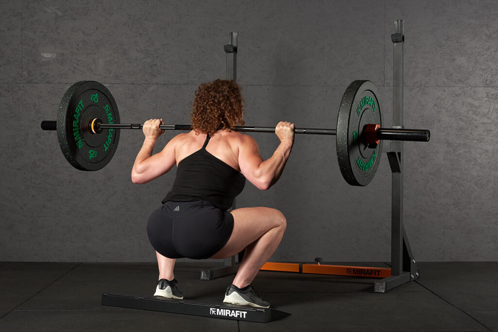 Mirafit M130 Adjustable Squat & Bench Press Rack Heel Raised High Barbell Back Squat with a Mirafit Squat Ramp and 10kg weight plates