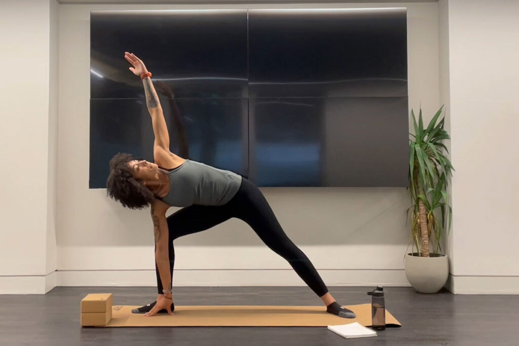 Extended Side Angle Pose Woman doing an extended side angle pose