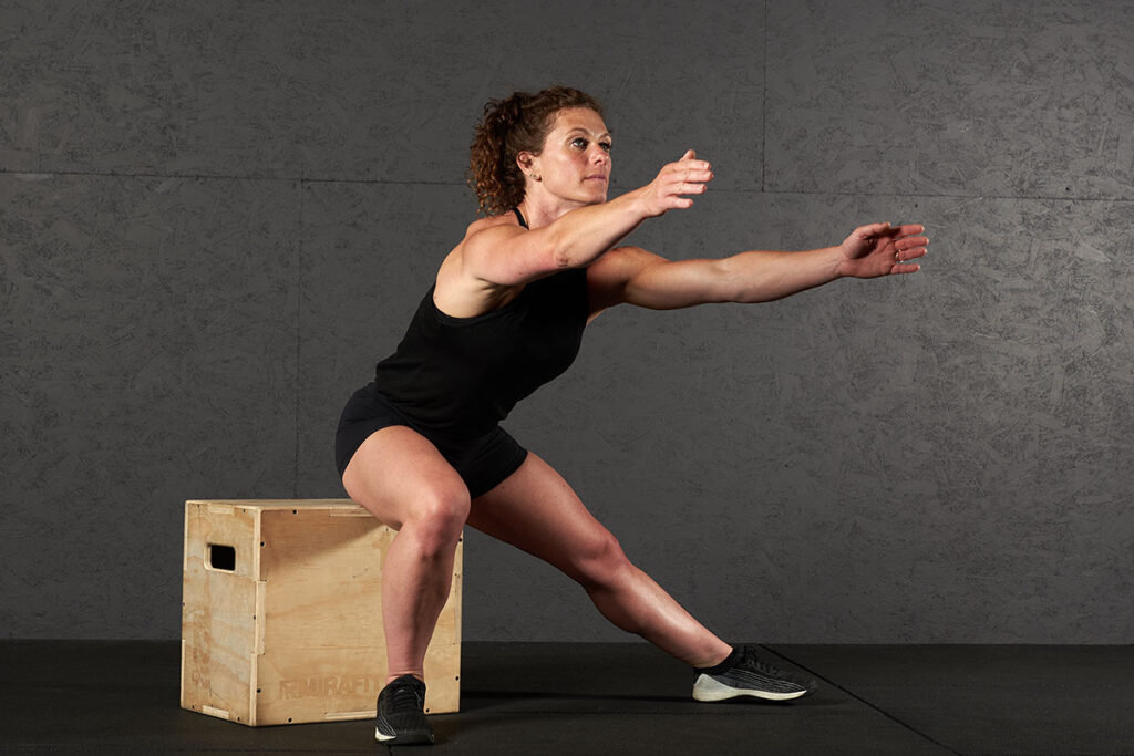 Mirafit 3in1 Wooden Plyo Jump Box Woman doing a plyo box side lunge on a Mirafit 3in1 Wooden Plyo Jump Box