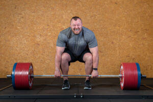Strongman Adam Bishop deadlifting Mirafit Weight Plates