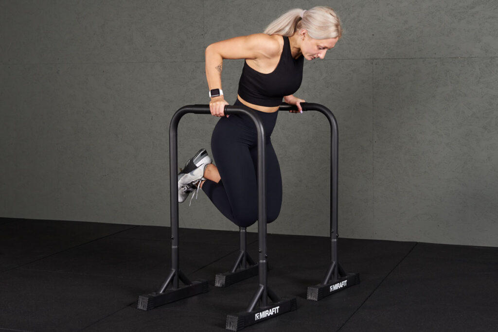Tricep Dip woman doing a Tricep Dip on Mirafit Parallettes