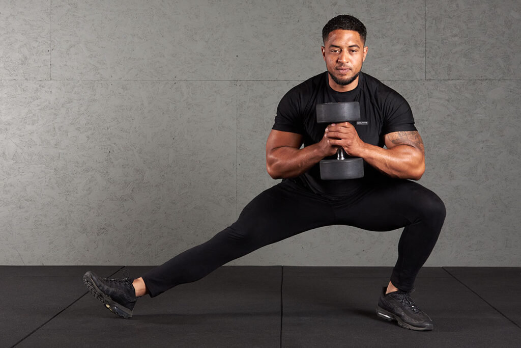 Man Doing Cossack Squats with a Mirafit Dumbbell