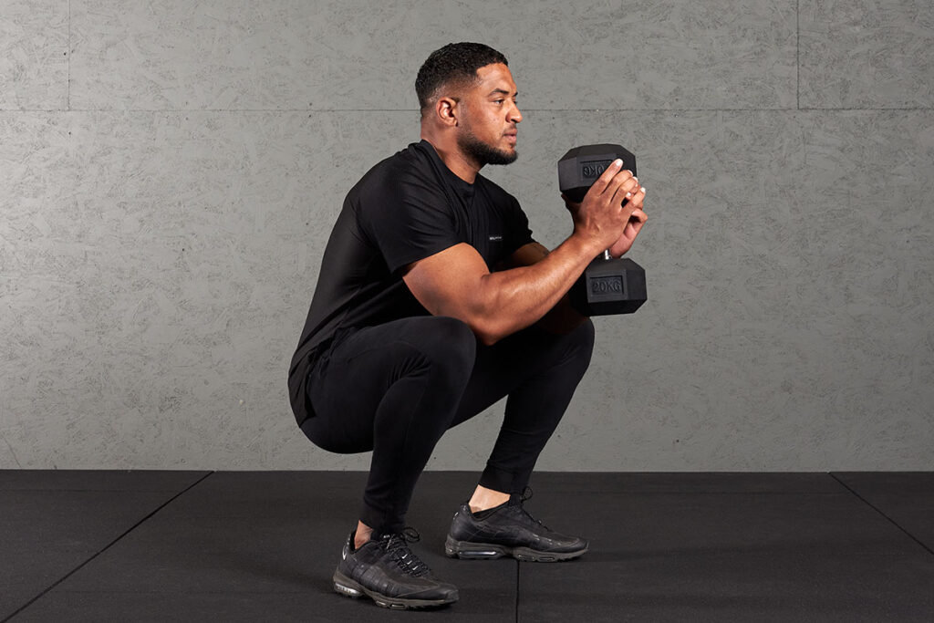 Man Doing Goblet Squat with Mirafit Hex Dumbbell