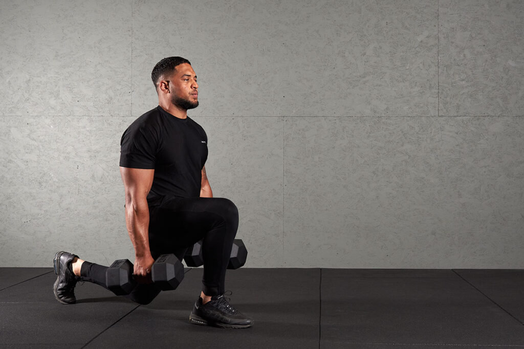Man Doing Dumbbell Overhead Squat with Mirafit Hex Dumbbells