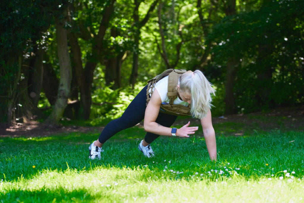 Shoulder Taps Woman doing shoulder taps in a Mirafit Tactical Weight Vest