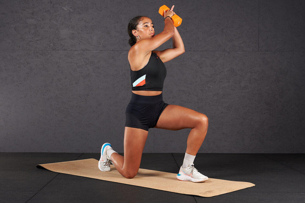 Kneeling woodchoppers Woman doing kneeling wood choppers with Mirafit Soft Touch Dumbbells