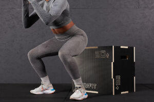Woman doing a Drop Landing on a Mirafit Wooden Plyo Box