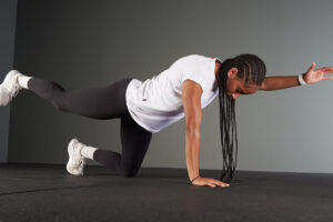 Woman doing the bird dog stretch