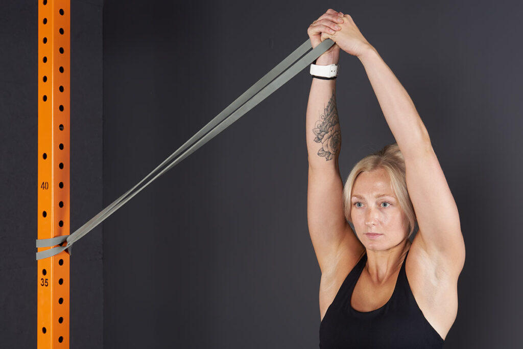 Pallof Press with overhead reach using a Mirafit Resistance Band