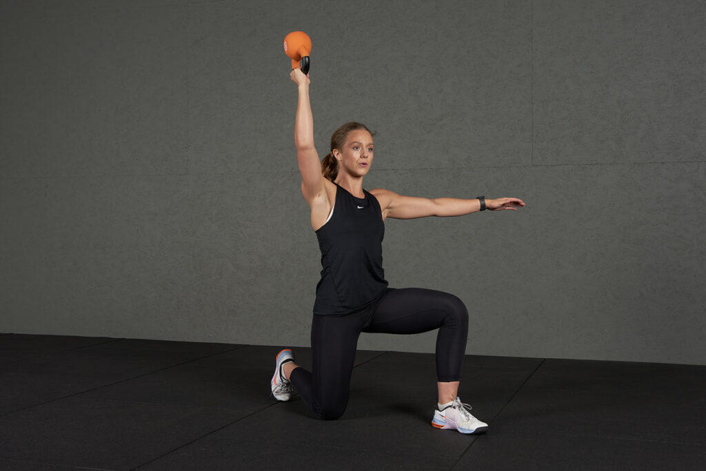 Single Arm Kettlebell Overhead Press Single Arm Kettlebell Overhead Press with a Mirafit Soft Touch Cast Iron Kettlebell